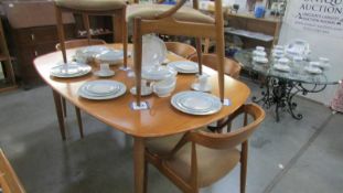 A good quality teak dining table with 6 dining chairs.