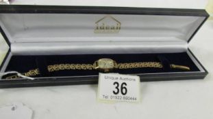 A 9ct gold ladies Avia wrist watch on 9ct gold bracelet, total weight 13.6 grams.