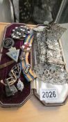 A mixed lot including old plated belt, badges etc.