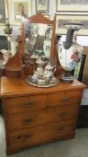 A satin walnut dressing table.