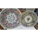 Two hand decorated studio pottery plates.
