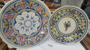 Two hand decorated studio pottery plates.