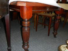 A mahogany dining table.