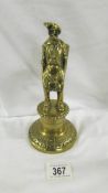 A Victorian brass figural bar top gas lighter in the form of a Dray Man.