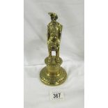 A Victorian brass figural bar top gas lighter in the form of a Dray Man.