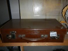 A small vintage suitcase in excellent condition.