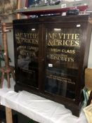 A 2 door glazed display cabinet with McVitie & Price Biscuits advertising.