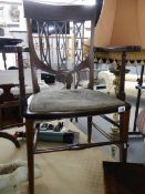 A mahogany inlaid elbow chair.