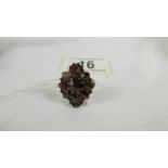 A 9ct gold ring set garnets, size T.