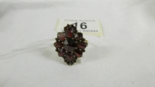 A 9ct gold ring set garnets, size T.