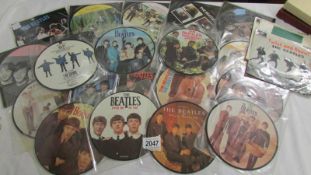 22 Beatles 45 rpm picture discs and 3 others.