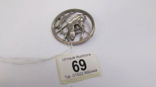 A George Jensen brooch in silver 'Deer Amongst Trees', with open work stylised setting,