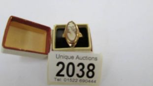 A 9ct gold cameo ring, size J half.