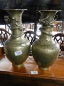 A pair of Chinese bronze dragon vases. 35 cm tall.