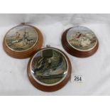 3 framed Pratt ware pot lids Including 'The Sportsman' and 'Peace'.