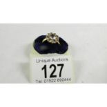 A cluster ring size O, (tests as 24ct gold).