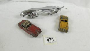 A Jaguar car mascot and 2 Dinky Jaguar XK120 cars.