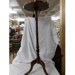 A good quality mahogany pot stand on tripod base.