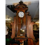 A single weight Victorian mahogany Vienna wall clock, in working order.