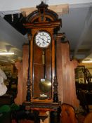 A single weight Victorian mahogany Vienna wall clock, in working order.