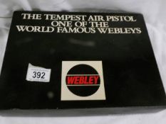 A boxed Webley Tempest 22 calibre air pistol with targets and pellets.