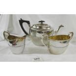 A three piece silver plate tea set marked S B & M, 2616.