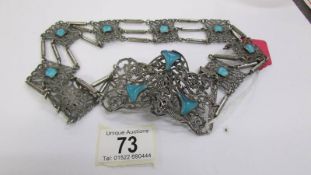 An art nouveau belt circa 1890-1910 in silver coloured metal with blue insets.