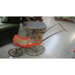 An early dolls push chair.