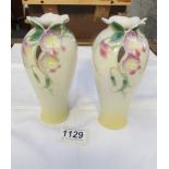 A pair of Franz porcelain vases.