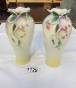 A pair of Franz porcelain vases.