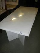 A white marble coffee table. ****Condition report**** Top 101cm x 51cm. Height 46.