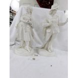 A pair of 19th century Parian figures of courtiers, 30 cm (12" ) tall.