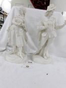 A pair of 19th century Parian figures of courtiers, 30 cm (12" ) tall.