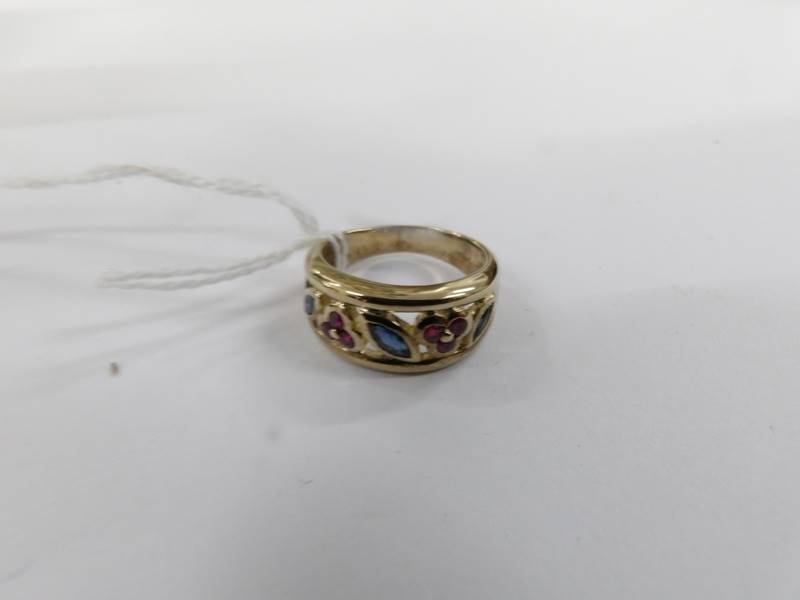 A ruby and sapphire open Welsh gold work ring in a wide band in 9ct gold, size M. - Image 2 of 2