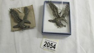 2 marcasite brooches in the form of eagles.