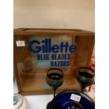 A glazed shop cabinet with Gillette lettering.