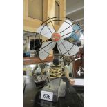 A vintage metal table fan.