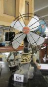 A vintage metal table fan.