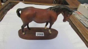 A brown Beswick horse, in good condition.