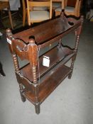 An oak book rack. ****Condition report**** Length 58.5cm. Height 72cm. Depth 11.