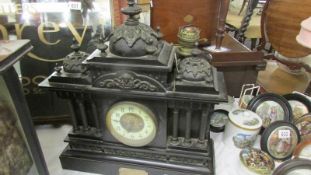 A Victorian black marble Paladian style 8 day mantel clock.