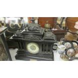 A Victorian black marble Paladian style 8 day mantel clock.