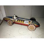 A Marx clockwork racing car. ****Condition report**** It is not working.