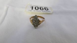 A 9ct gold diamond shaped ring set clear stones, size M.