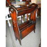 An arts and crafts oak book rack.