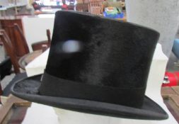 A silk top hat by Tresds & Co., Ltd., London. ****Condition report**** No size label.