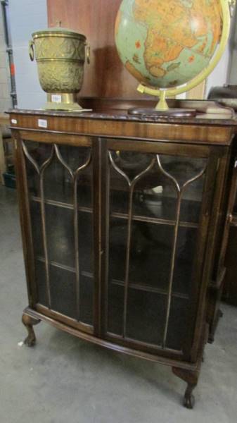 A mahogany astragal glazed cabinet.
