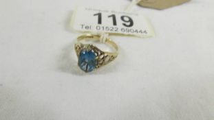 A blue topaz ring in openwork band in 9ct gold, size J.