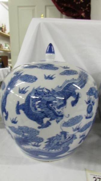 A striking pair of large blue and white lidded porcelain melon ginger jars with dragons chasing - Image 3 of 6