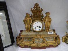 A good gilded spelter mantel clock with alabaster plaques,